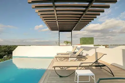 Image de 2 chambres pour 5, entièrement équipée et piscine à débordement à Aldea Zama