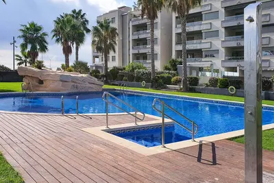 Image de At187 Nova Torredembarra: Planta baja con jardín privado y acceso directo a piscina comunitaria.