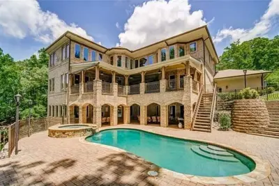 Your Private Gated  Castle Escape on Lake Lanier-Beachfront, Gym, Pool &Jacuzzi!