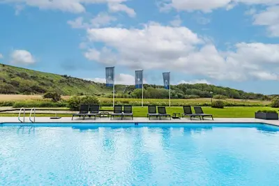 Seaside Bliss with Outdoor Swimming Pool, Beach Loungers & Tennis Court Fun