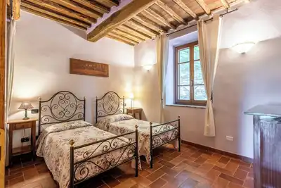 Image de Chambre 'Podere Marroneto - Camera 1' avec vue montagne, piscine partagée et Wi-Fi