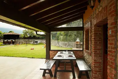 Image de La Rotella de Xuan: Appartement 'Amarillo' avec vue sur les montagnes, terrasse et jardin partagé