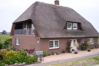 Image de Friesenkate- thatched house, garden, sauna, close to the beach
