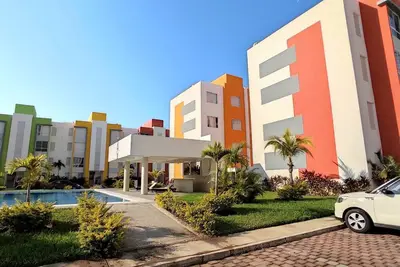 Image de 8 minutes from the beach! Family apartment with pool & gardens in private gated community