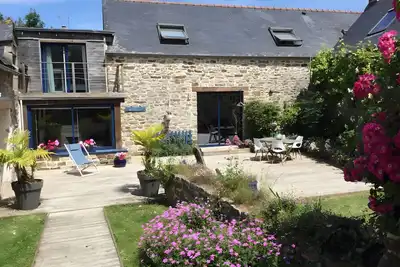 Image de Maison de vacances 'Avec Piscine-Cap Sizun' avec terrasse privée, jardin privé et Wi-Fi