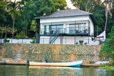 Image de Charming 2-bedroom cottage facing river with Ac, WiFi in welcoming Aluva