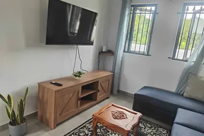 Luxury villa near Bras d'Eau Beach with private pool and lush natural views.