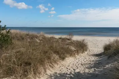 Image de Vacation home behind the dune - We are the left sunny side :)