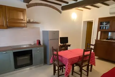 Image de Appartement 'Podere Le Sugherine - Camino' avec piscine partagée, Wi-Fi et climatisation
