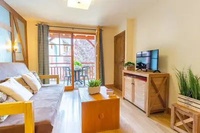 Image de Appartement central avec piscine, sauna et Wifi