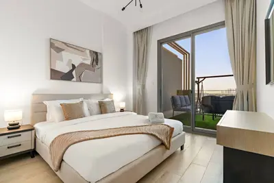 Image de Bright 2br Retreat | Balcony & Pool Near Jumeirah Village Circle