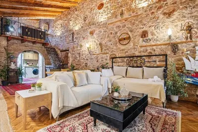 Image de Olvion House: rustic stone retreat in Athens with a cozy private courtyard.