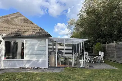 Image de Duinroos Breskens: Affordable holiday home in Strandpark Schoneveld with garden, perfect for families. Book your beach holiday in Zeeland!