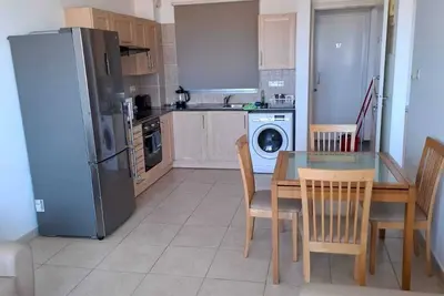 Image de Top floor apartmenT with community pool and sea views