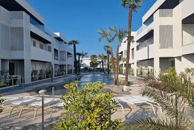 Image de New apartment in residence with pool, 350 m from the sea, 3 min from Caribe Bay