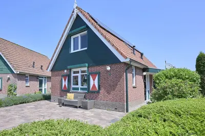 Image de Maison avec 2 salles de bains et salon véranda