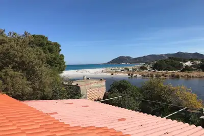 Image de Maison de vacances 'On The Sea Fenicottero' avec vue sur la mer, terrasse privée et jardin privé