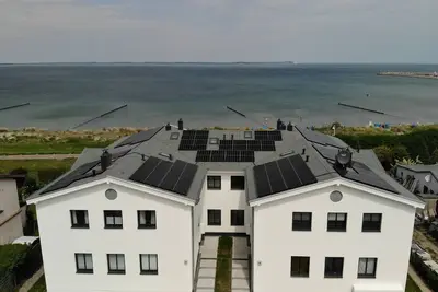 Apartment first beach line with direct sea view in new building in Glowe