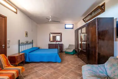 Image de Maison de vacances 'Rosso Pepe' avec terrasse privée, jardin privé et climatisation