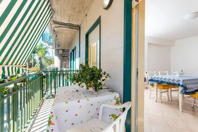 Image de Appartement 'I Ciottoli Dello Ionio - Apt 15' avec vue sur la mer, terrasse commune et balcon