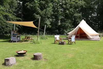Image de Iris, Lilypad and Bulrush are luxury bell tents all set privately in a wild meadow.