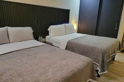 Image de Double room 04 with 2 double beds, air conditioning, private bathroom