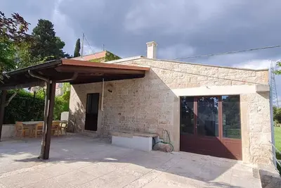 Image de Stone farmhouse surrounded by greenery with shared pool