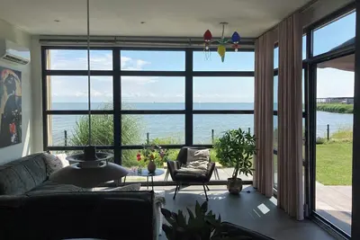 Image de Chalet in first row by the sea with fence and fantastic view