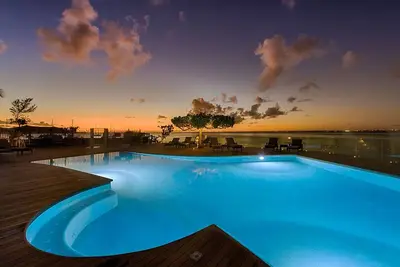 Image de Serene Beachfront Suite| Private Beaches, Balcony Views & Water Adventures