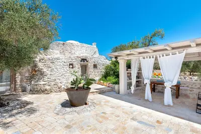 Image de Trullo 'Alma' avec Terrasse Privée, Wi-Fi et Climatisation