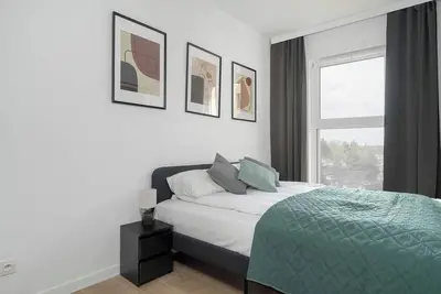 Image de Tasteful Apartment with Parking and Gym by Noclegi Renters