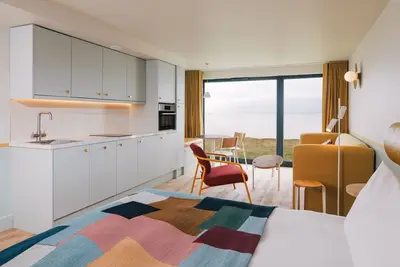 Image de Open plan sea view studio with super king size bed, kitchen, lounge area and a separate bunk room.