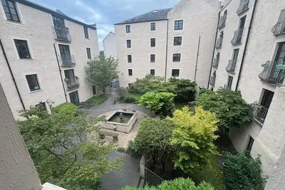 Image de Converted Crabbies Ginger Ale Warehouse. Pleasant Courtyard on entrance.