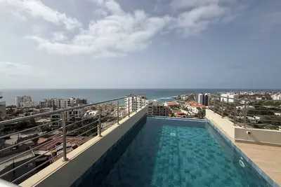 Image de Appartement haut standing avec rooftop, salle de jeu, à 5 min de la plage