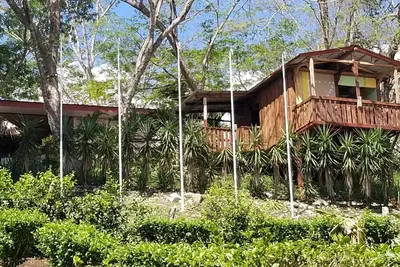 Image de Cozy wooden cabin with every comfort and a view of the nearby golf course.