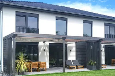 Image de Maison de vacances 'Schlossterrassen 8b' avec vue sur le lac, terrasse privée et Wi-Fi