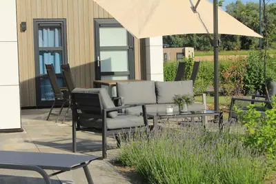 Image de Top chalet 'Inseltraum' with fence & Airco - arrive, switch off, feel good