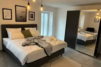 Image de Moselquartier \"Reben Apartment\" up to 4 persons `modern kitchen` box spring bed