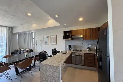 Image de Vista Bucerias 301 is a 2 Bedroom Condo with rooftop pool steps to the beach.