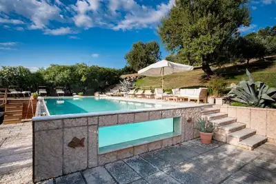 Image de Oasi Dolce Vita house surrounded by greenery with swimming pool, tennis and panoramic view