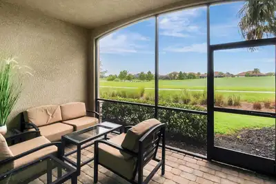 Image de Enjoy views of the immaculate green from your screened lanai at Lakeside National - Golfside Escape