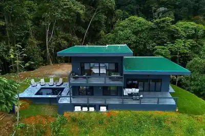 Image de Beautiful new home with wrap around views of the ocean and two waterfalls