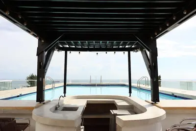 Image de Spacious family apartment in Pozos Colorados, direct access to the beach, swimming pool, rooftop terrace, etc.