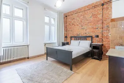 Image de Gliwice Industrial Brick Style Apartment