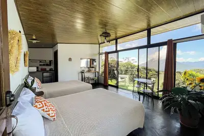 Image de Adventure and relaxation: Balcony with views of the stunning Volcano and Lake.