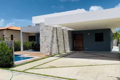 Exclusive paradise, House in a beachfront condominium.