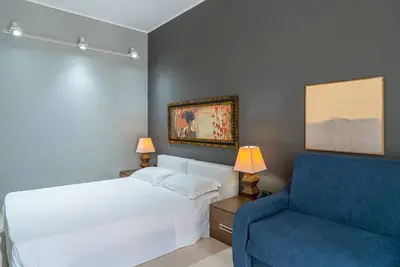 Image de Chambre 'Wright - Quadrupla Supérieure' avec jardin partagé, Wi-Fi et climatisation