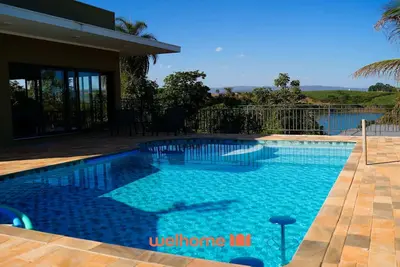 Image de Casa em Delfinopolis com piscina aquecida e vista