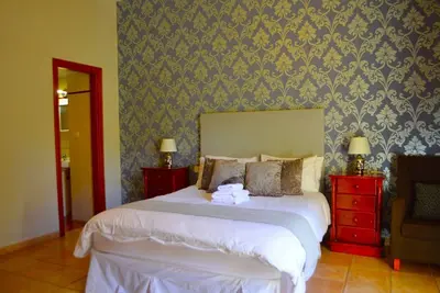 Image de Spacious Family room that can accommodate up to 2 adults and 1 child. En-suite bathroom with shower. There is  a king size bed and a single bed if required. The room has views of the village square.