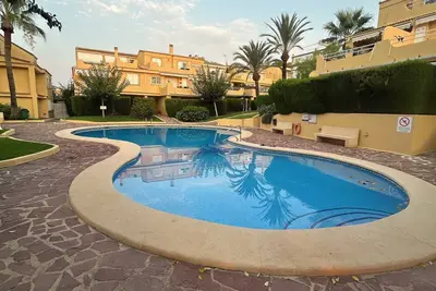 Image de Duplex apartment in Urbanization with pool 400 meters from the beach in Javea